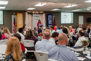 Erin Birch speaks at 2023 Community Impact Breakfast