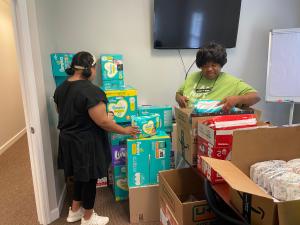 Volunteers sort diapers for 2022 Mom and Baby Care Drive