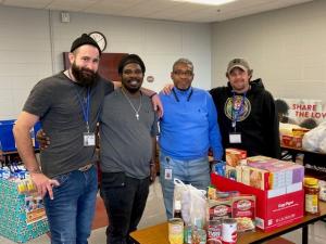 UWSC volunteers with Douglas Fuqua Sr. pictured in blue