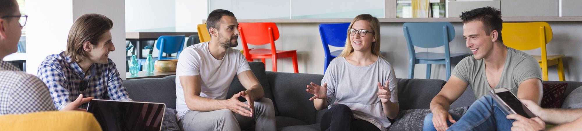 Seated employees casually talking