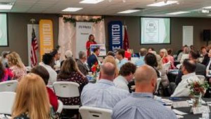Erin Birch speaking to crowd at 2023 UWSC Community Impact Breakfast